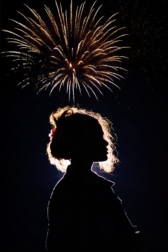 After Example of Fireworks Overlays - silhouette of a young woman with fireworks in the background